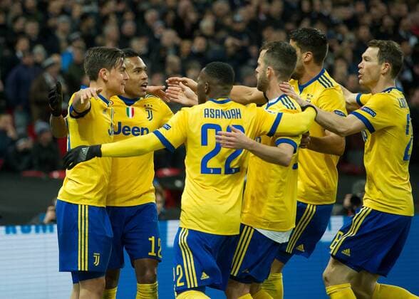 Paulo Dybala of Juventus celebrates scoring the winning goal with his team mates during the UEFA Champions League round of 16 leg 2of2 match between Tottenham Hotspur and Juventus at Wembley Stadium, London, England on 7 March 2018. Copyright: xVincexMignottx PMI-1866-0082