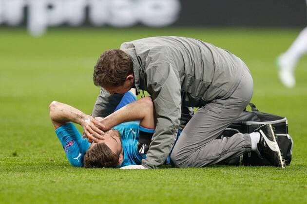 Calum Chambers of Arsenal needs medical attentions during the UEFA Europa League Round of 16 match between AC Milan and Arsenal at Stadio San Siro, Milan, Italy on 8 March 2018. Copyright: xRobertoxBreganix 19210006