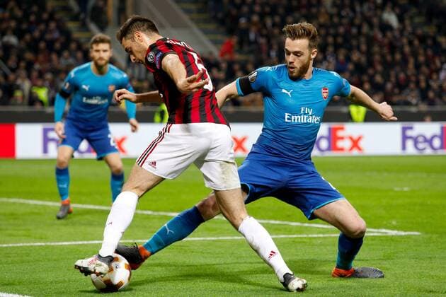 Calum Chambers of Arsenal against Giacomo Bonaventura of Ac Milan during the UEFA Europa League Round of 16 match between AC Milan and Arsenal at Stadio San Siro, Milan, Italy on 8 March 2018. Copyright: xRobertoxBreganix 19210023