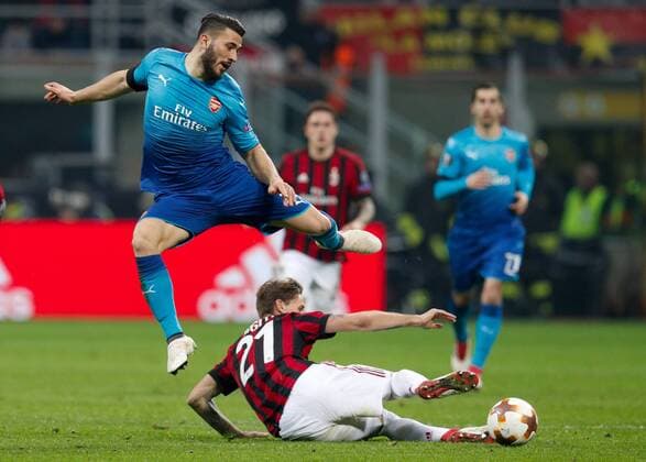 Sead Kolasinac of Arsenal against Lucas Biglia of Ac Milan during the UEFA Europa League Round of 16 match between AC Milan and Arsenal at Stadio San Siro, Milan, Italy on 8 March 2018. Copyright: xRobertoxBreganix 19210031