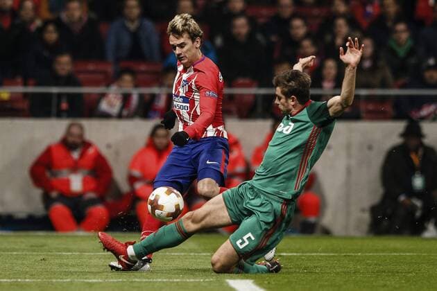 8th March 2018, Wanda Metropolitano, Madrid, Spain; UEFA Europa League football, round of 16, 1st leg, Atletico Madrid versus Lokomotiv& xa0;Moscow; Antonie Griezmann (Atletico de Madrid) chips he ball into the box past Nemanja Pejcinovic (Lokomotiv)  ActionPlus11999263