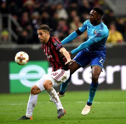 (180309) -- MILAN, March 9, 2018 -- AC Milan s Ricardo Rodriguez (L) competes with Arsenal s Danny Welbeck during a Europa League round of 16 first leg soccer match between AC Milan and Arsenal at the San Siro stadium in Milan, Italy, March 8, 2018. Arsenal won 2-0. ) (SP)ITALY-MILAN-EUROPA LEAGUE-AC MILAN VS ARSENAL AlbertoxLingria 