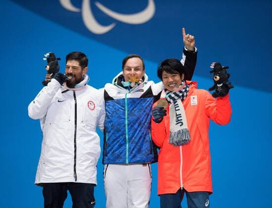 March 12, 2018 - Pyeongchang, South Korea - Left to right, silver medalist Keith Gabel of the US, Matti Suur-Hamari of Finland (gold) and Gurimu Narita of Japan (bronze) celebrate during a medal ceremony for Men s Snowboard Cross Monday, March 12, 2018 at the Medals Plaza for the 2018 Pyeongchang Winter Paralympic Games. Paralympics PyeongChang 18: Snowboard - ZUMAr157 20180312_zap_r157_031 Copyright: xMarkxReisx