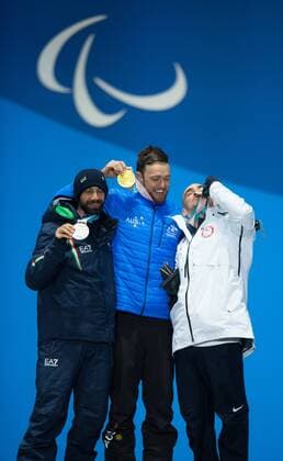 March 12, 2018 - Pyeongchang, South Korea - Left to right, silver medalist Manuel Pozzerle of Italy (bronze), Simon Patmore of Australia (gold) and Mike Minor of the US celebrate during a medal ceremony for Men s Snowboard Cross Monday, March 12, 2018 at the Medals Plaza for the 2018 Pyeongchang Winter Paralympic Games. Paralympics PyeongChang 18: Snowboard - ZUMAr157 20180312_zap_r157_036 Copyright: xMarkxReisx
