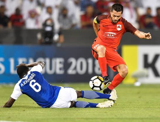 (180313) -- DOHA, March 13, 2018 -- Abdulmalek Al-Khaibri (Down) of Al-Hilal FC vies with Rodrigo Tabata of Al-Rayyan during the AFC Champions League Group D soccer match between Qatar s Al-Rayyan and Saudi Arabia s Al-Hilal FC at Jassim Bin Hamad Stadium in Doha, capital of Qatar, March 12, 2018. Qatar s Al-Rayyan won 2-1. ) (SP)QATAR-DOHA-SOCCER-AFC CHAMPIONS-GROUP D Nikku 