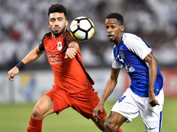 (180313) -- DOHA, March 13, 2018 -- Ahmed Yasser (L) of Al-Rayyan vies with Mokhtar Falatah of Al-Hilal FC during the AFC Champions League Group D soccer match between Qatar s Al-Rayyan and Saudi Arabia s Al-Hilal FC at Jassim Bin Hamad Stadium in Doha, capital of Qatar, March 12, 2018. Qatar s Al-Rayyan won 2-1. ) (SP)QATAR-DOHA-SOCCER-AFC CHAMPIONS-GROUP D Nikku 