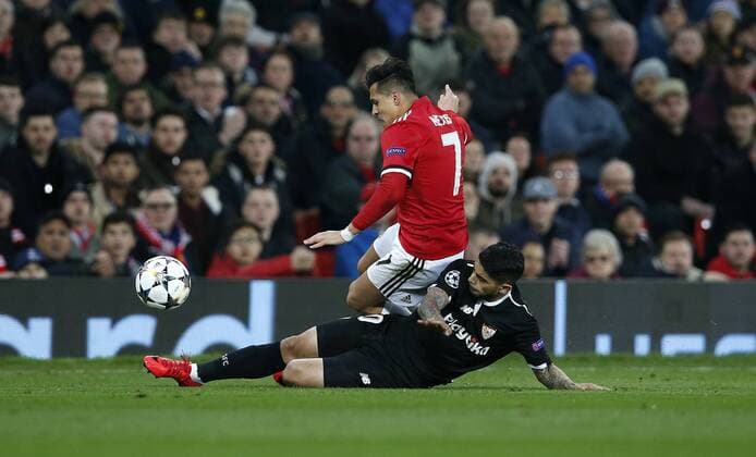 Alexis Sanchez of Manchester United ManU is tackled by Ever Banega of Sevilla during the Champions League Round of 16 match at Old Trafford Stadium, Manchester. Picture date: March 13th 2018. Picture credit should read: Andrew Yates Sportimage EDITORIAL USE ONLY. No use with unauthorised audio, video, data, fixture lists, club league logos or live services. Online in-match use limited to 120 images, no video emulation. No use in betting, games or single club league player publications.