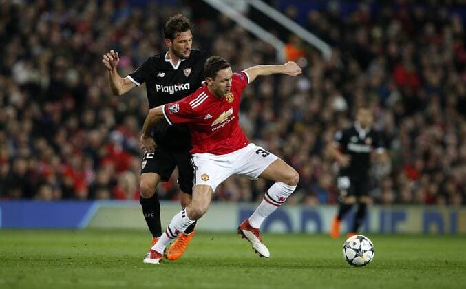 Franco Vazquez of Sevilla and Nemanja Matic of Manchester United ManU during the Champions League Round of 16 match at Old Trafford Stadium, Manchester. Picture date: March 13th 2018. Picture credit should read: Andrew Yates Sportimage EDITORIAL USE ONLY. No use with unauthorised audio, video, data, fixture lists, club league logos or live services. Online in-match use limited to 120 images, no video emulation. No use in betting, games or single club league player publications.