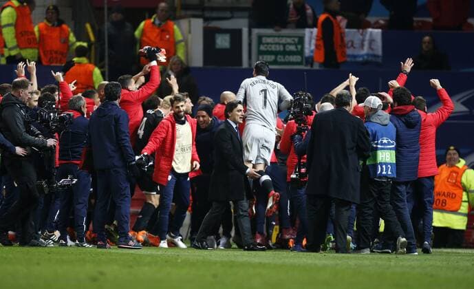 Vincenzo Montella manager of Sevilla and his team celebrate after winning the Champions League Round of 16 match at Old Trafford Stadium, Manchester. Picture date: March 13th 2018. Picture credit should read: Andrew Yates Sportimage EDITORIAL USE ONLY. No use with unauthorised audio, video, data, fixture lists, club league logos or live services. Online in-match use limited to 120 images, no video emulation. No use in betting, games or single club league player publications.
