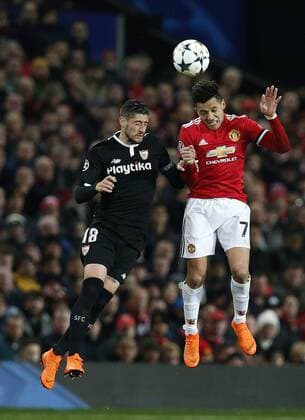 Sergio Escudero of Sevilla and Alexis Sanchez of Manchester United ManU during the Champions League Round of 16 match at Old Trafford Stadium, Manchester. Picture date: March 13th 2018. Picture credit should read: Andrew Yates Sportimage EDITORIAL USE ONLY. No use with unauthorised audio, video, data, fixture lists, club league logos or live services. Online in-match use limited to 120 images, no video emulation. No use in betting, games or single club league player publications.