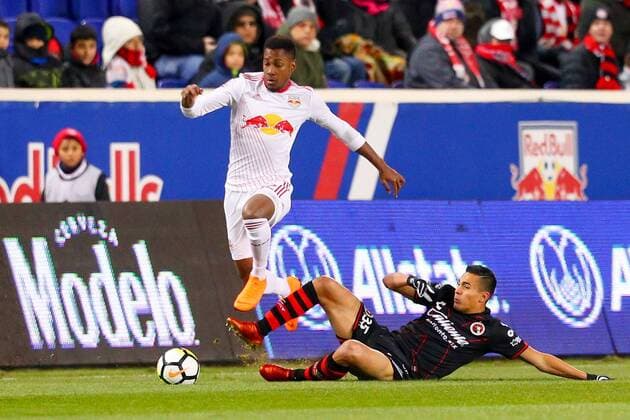 HARRISON, NJ - MARCH 13: New York Red Bulls defender Michael Murillo (62) hurdles Tijuana forward Rubio Rubin (35) during the first half of the CONCACAF Champions League Quarter-final match between the New York Red Bulls and Club Tijuana on March 13, 2018, at Red Bull Arena in Harrison, NJ. (Photo by Rich Graessle Icon Sportswire) SOCCER: MAR 13 CONCACAF CHAMPIONS LEAGUE - CLUB TIJUANA AT NEW YORK RED BULLS Icon0313183233 EDITORIAL USE ONLY