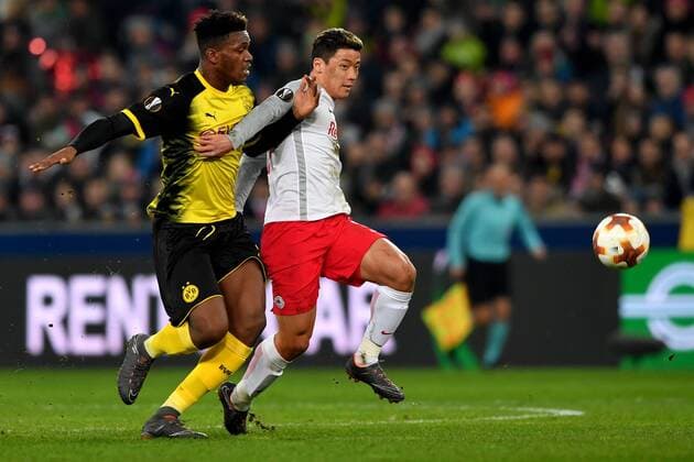 SOCCER - UEFA EL, RBS vs Dortmund SALZBURG,AUSTRIA,15.MAR.18 - SOCCER - UEFA Europa League, round of 16, Red Bull Salzburg vs Borussia Dortmund. Image shows Dan Axel Zagadou (Dortmund) and Hee Chan Hwang (RBS). GEPAxpictures xFlorianxErtl