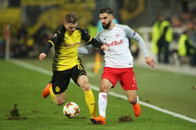 SOCCER - UEFA EL, RBS vs Dortmund SALZBURG,AUSTRIA,15.MAR.18 - SOCCER - UEFA Europa League, round of 16, Red Bull Salzburg vs Borussia Dortmund. Image shows Lukasz Piszczek (Dortmund) and Munas Dabbur (RBS). GEPAxpictures xMathiasxMandl