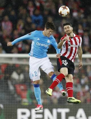Football: Marseille s Sakai Marseille defender Hiroshi Sakai challenges Aritz Aduriz of Athletic Bilbao in the air during their Europe League match on March 15, 2018, in Bilbao, Spain. 