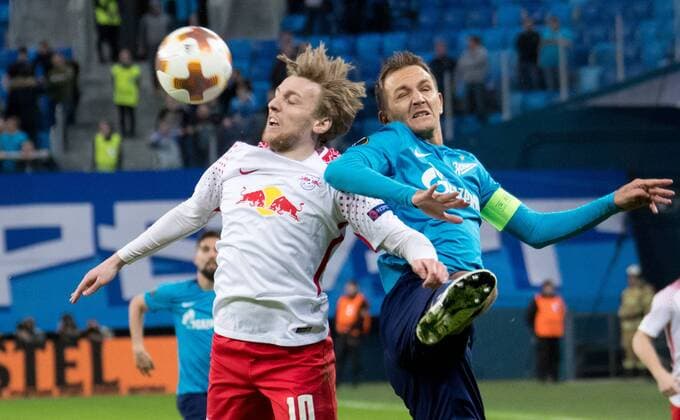 15.03.2018. Russia, Saint Petersburg, Saint Petersburg Stadium. UEFA Europa League 2017 18, Round of 16, Second leg, Zenit â€” RB Leipzig. RB Leipzig s Emil Forsberg (L) and Zenit St Petersburg s Domenico Criscito (R). Football, Match  Copyright: xAndreyxIvanovx