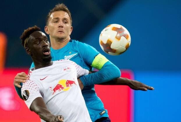 15.03.2018. Russia, Saint Petersburg, Saint Petersburg Stadium. UEFA Europa League 2017 18, Round of 16, Second leg, Zenit â€” RB Leipzig. RB Leipzig s Jean-Kevin Augustin (L) and Zenit St Petersburg s Domenico Criscito (R). Football, Match  Copyright: xAndreyxIvanovx