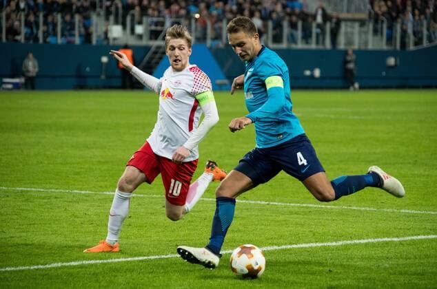 15.03.2018. Russia, Saint Petersburg, Saint Petersburg Stadium. UEFA Europa League 2017 18, Round of 16, Second leg, Zenit â€” RB Leipzig. RB Leipzig s Emil Forsberg (L) and Zenit St Petersburg s Domenico Criscito (R). Football, Match  Copyright: xAndreyxIvanovx