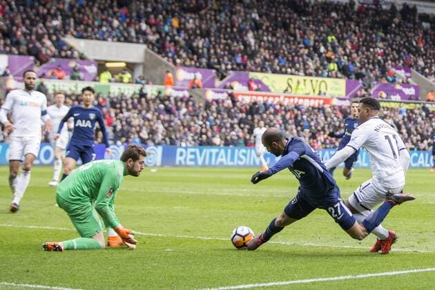 Lucas Moura of Tottenham Hotspur falls under a challenge from Luciano Narsingh of Swansea City during the FA Cup Quarter Final match between Swansea City and Tottenham Hotspur at the Liberty Stadium, Swansea, Wales on 17 March 2018. Copyright: xMarkxxHawkinsx PMI-1893-0062