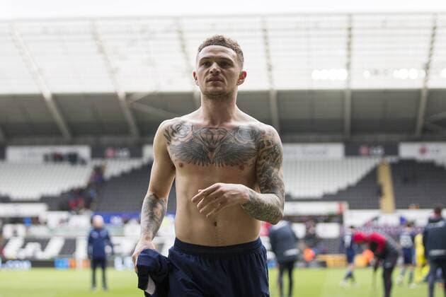 Kieran Trippier of Tottenham Hotspur gives his shirt to fans at full time of the FA Cup Quarter Final match between Swansea City and Tottenham Hotspur at the Liberty Stadium, Swansea, Wales on 17 March 2018. Copyright: xMarkxxHawkinsx PMI-1893-0083