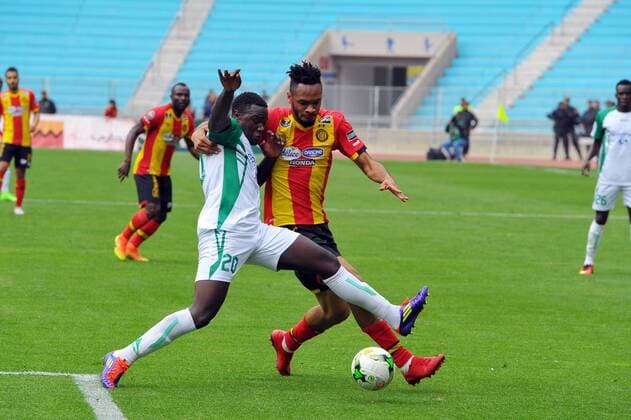 Foussent Colibaly(R)and Wendo Ernest (20) during the match Esperance Sportive de Tunis who validated his ticket to the group phase of the African Champions League after a short victory of (1-0) face Gor Mahia Kenyan club in the second leg of the final of the competition sixteenths played at Rades stadium. African Champions League:EST vs Gor Mahia. 