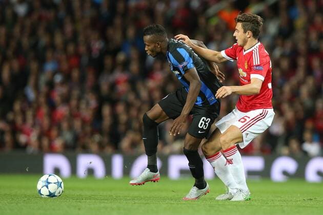 - MANCHESTER, UNITED KINGDOM: Club s Boli Bolingoli Mbombo and Manchester s Matteo Darmian fight for the ball during a soccer game between British club Manchester United ManU FC and Belgian team Club Brugge KV in Manchester, United Kingdom, Tuesday 18 August 2015, the first leg of the play-offs for the UEFA Champions League competition. BRUNOxFAHY x84381022x