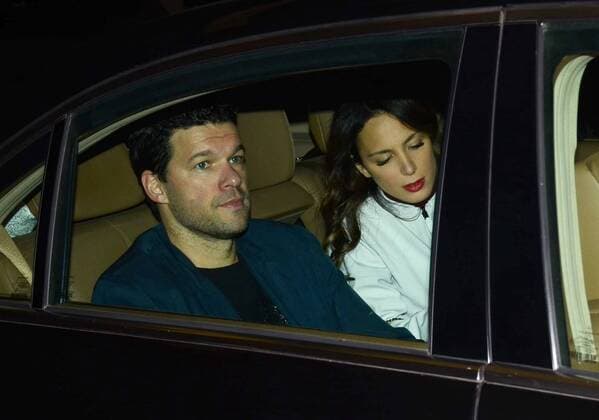 Retired German football player Michael Ballack and his girlfriend Natacha Tannous are pictured in a car outside the hotel in Shanghai, China, 19 March 2018. Michael Ballack spotlighted as he and girlfriend go out of hotel in Shanghai  pbu771049_25
