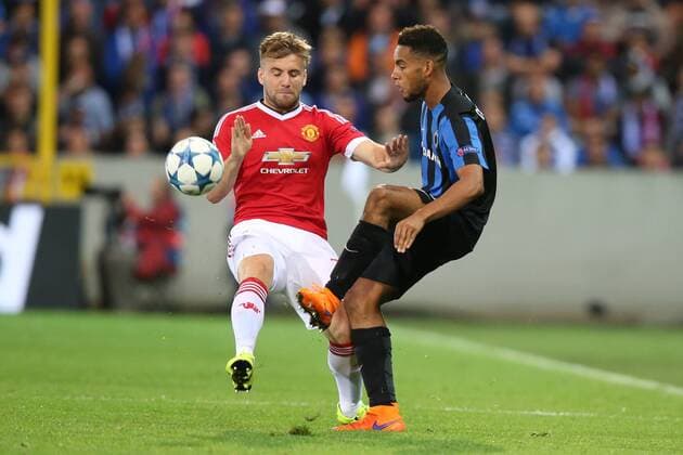 - BRUGGE, BELGIUM: Manchester s Luke Shaw and Club s Jean-Charles Castelletto fight for the ball during a soccer game between Belgian first league team Club Brugge KV and British club Manchester United ManU FC in Brugge, Wednesday 26 August 2015, the return game of the play-offs of the UEFA Champions League competition. Manchester United won the first leg 3-1. BRUNOxFAHY x84637559x