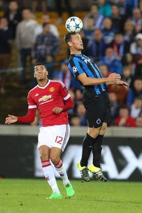 - BRUGGE, BELGIUM: Manchester s Chris Smalling and Club s Tom De Sutter fight for the ball during a soccer game between Belgian first league team Club Brugge KV and British club Manchester United ManU FC in Brugge, Wednesday 26 August 2015, the return game of the play-offs of the UEFA Champions League competition. Manchester United won the first leg 3-1. BRUNOxFAHY x84637739x