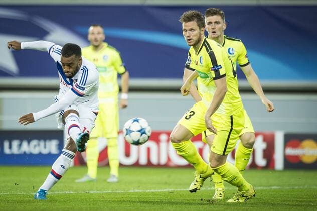 - GENT, BELGIUM: Lyon s Alexandre Lacazette and Gent s Lasse Nielsen fight for the ball during the first game in the group stage of the Uefa Champions League competition, in group H, between Belgian first league soccer team KAA Gent and Olympique Lyon, in Gent, Wednesday 16 September 2015. JASPERxJACOBS x85281296x