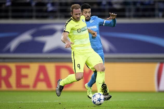 - GENT, BELGIUM: Gent s Laurent Depoitre and Zenit s Ezequiel Garay fight for the ball during a soccer game between Belgian team KAA Gent and Russian club FC Zenit Saint Petersburg, Wednesday 09 December 2015, in Gent, the sixth and last day of the group stage the UEFA Champions League competition, in group H. YORICKxJANSENS x88058237x