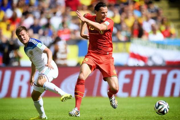 - RIO DE JANEIRO, BRAZIL: Russia s Maksim Kanunnikov and Belgium s Daniel Van Buyten fight for the ball during a soccer game between Belgian national team Nationalteam The Red Devils and Russia in Rio de Janeiro, Brazil, the second game in Group H of the first round of the 2014 FIFA World Cup WM Weltmeisterschaft Fussball Sunday 22 June 2014. YORICKxJANSENS  x59622140x
