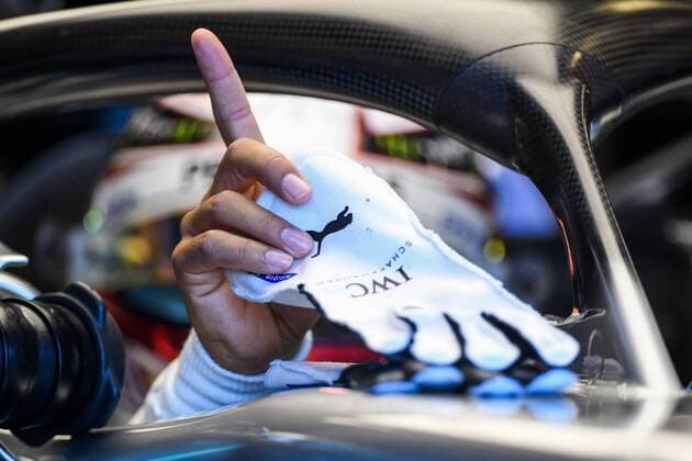 23rd March 2018, Melbourne Grand Prix Circuit, Melbourne, Australia; Melbourne Formula One Grand Prix, Friday free practice; Lewis Hamilton of Great Britain picks up his gloves as he climbs into the (44) Mercedes AMG Petronas F1 Team Mercedes WO9 on track  ActionPlus12004127
