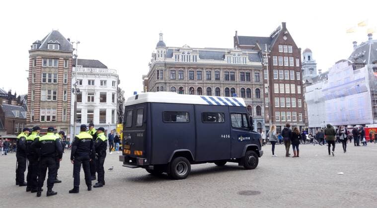 England football fans in Amsterdam Amsterdam The Netherlands 23rd March 2018 England football fans in Amsterdam for their sides game against The Netherlands this evening. The local mobiele eenheid (riot police) on the Dam ready for any disturbances. Whilst on the Dam things are relatively peaceful being populated mainly with tourists taking selfies it has been reported in local media that the police arrested 25 English fans in the Red Light District last night. 