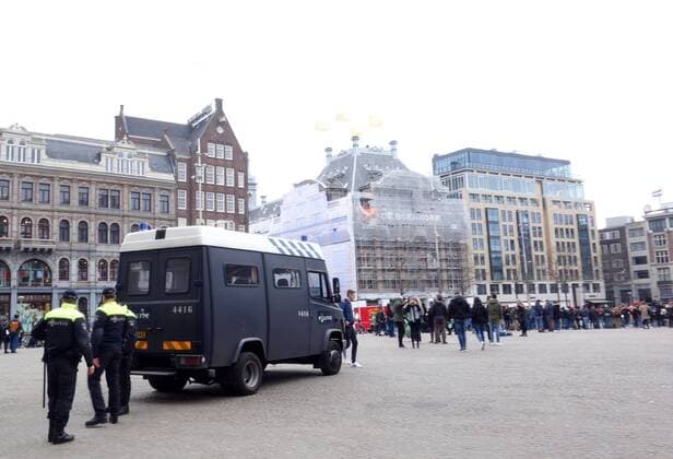 England football fans in Amsterdam Amsterdam The Netherlands 23rd March 2018 England football fans in Amsterdam for their sides game against The Netherlands this evening. The local mobiele eenheid (riot police) on the Dam ready for any disturbances. Whilst on the Dam things are relatively peaceful being populated mainly with tourists taking selfies it has been reported in local media that the police arrested 25 English fans in the Red Light District last night. 