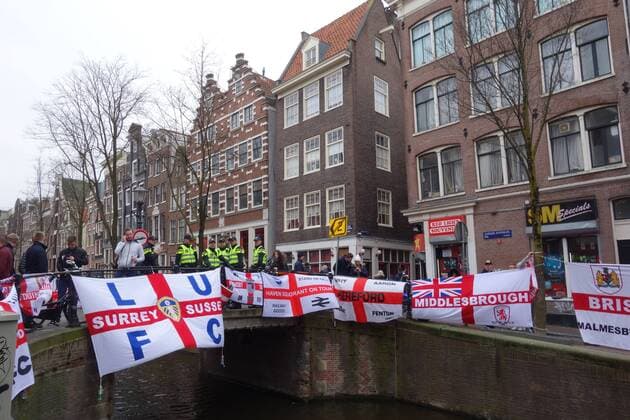 England football fans in Amsterdam Amsterdam The Netherlands 23rd March 2018 England football fans in Amsterdam for their sides game against The Netherlands this evening. English flags adorn the canals and bridges of the Red Light District. Whilst things are now relatively peaceful it has been reported in local media that the police arrested 25 English fans in the Red Light District last night. 