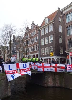 England football fans in Amsterdam Amsterdam The Netherlands 23rd March 2018 England football fans in Amsterdam for their sides game against The Netherlands this evening. English flags adorn the canals and bridges of the Red Light District. Whilst things are now relatively peaceful it has been reported in local media that the police arrested 25 English fans in the Red Light District last night. 