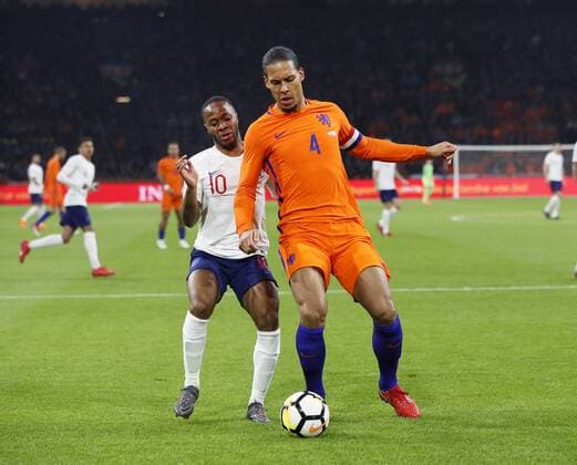 Netherland s Virgil Van Dijk tussles with England s Raheem Sterling during during the International Friendly Länderspiel match at the Amsterdam Arena, Amsterdam. Picture date: March 23rd 2018. Picture credit should read: David Klein Sportimage EDITORIAL USE ONLY. No use with unauthorised audio, video, data, fixture lists, club league logos or live services. Online in-match use limited to 120 images, no video emulation. No use in betting, games or single club league player publications.