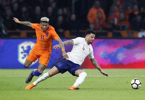 Netherland s Patrick Van Aanholt tussles with England s Kyle Walker during the International Friendly Länderspiel match at the Amsterdam Arena, Amsterdam. Picture date: March 23rd 2018. Picture credit should read: David Klein Sportimage EDITORIAL USE ONLY. No use with unauthorised audio, video, data, fixture lists, club league logos or live services. Online in-match use limited to 120 images, no video emulation. No use in betting, games or single club league player publications.