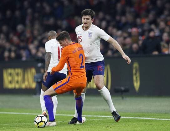 Netherland s Hans Hateboer tussles with England s Harry Maguire during the International Friendly Länderspiel match at the Amsterdam Arena, Amsterdam. Picture date: March 23rd 2018. Picture credit should read: David Klein Sportimage EDITORIAL USE ONLY. No use with unauthorised audio, video, data, fixture lists, club league logos or live services. Online in-match use limited to 120 images, no video emulation. No use in betting, games or single club league player publications.