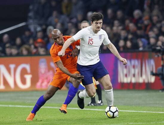 Netherland s Ryan Babel tussles with England s Harry Maguire during the International Friendly Länderspiel match at the Amsterdam Arena, Amsterdam. Picture date: March 23rd 2018. Picture credit should read: David Klein Sportimage EDITORIAL USE ONLY. No use with unauthorised audio, video, data, fixture lists, club league logos or live services. Online in-match use limited to 120 images, no video emulation. No use in betting, games or single club league player publications.