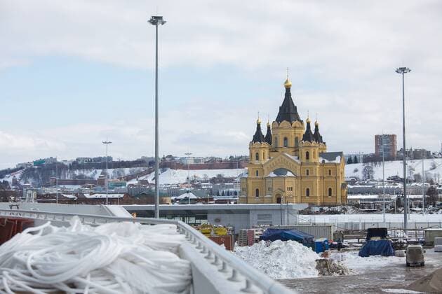 NIZHNY NOVGOROD, RUSSIA - MARCH 24, 2018: A view of Alexander Nevsky Cathedral Church from Nizhny Novgorod Stadium, a venue of the 2018 FIFA World Cup WM Weltmeisterschaft Fussball in Russia. Mikhail Solunin TASS  TS079297