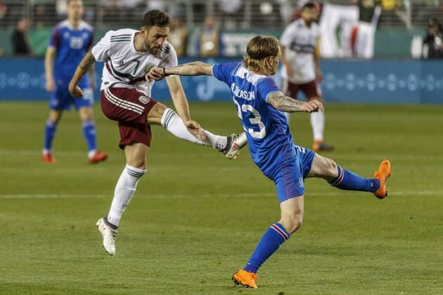 SANTA CLARA, CA - MARCH 23: Mexico Defender Miguel Layun (7) takes a shot which Iceland Defender Ari Skulason (23) tips over the net during the second half of the international match Länderspiel between Mexico and Iceland on Friday, March 23, 2018 at Levi s Stadium in Santa Clara, CA. Final Score: Mexico-3, Iceland-0. (Photo by Allan Hamilton Icon Sportswire) SOCCER: MAR 23 Mexico v Iceland Icon18032326 EDITORIAL USE ONLY