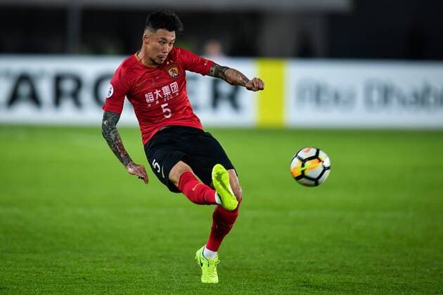 --FILE--Chinese soccer player Zhang Linpeng of Guangzhou Evergrande Taobao F.C. kicks the ball against South Korea s Jeju United in a Group G match during the 2018 AFC Champions League in Guangzhou city, south China s Guangdong province, 6 March 2018. Chinese soccer players might have been ordered to conceal their tattoos, media reported, after China s national team Nationalteam players were seen covering them at televised matches. The Chinese Football Association will issue regulations on tattoos for the Chinese Super League and other national team matches, news site thepaper.cn reported Sunday (25 March 2018). Players were spotted covering their tattoos with tape during the games of China s U23 national team against Syria on Saturday and national team Wales on Thursday, thepaper.cn reported. However, covering tattoos seemed to hardly change the fate of the Chinese team, which lost to Wales, 0-6. Chinese Football Association to ban tattoo from players: report  20180306_56721
