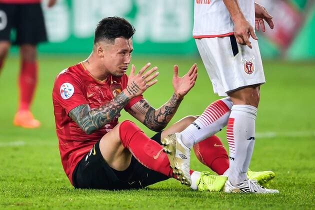 --FILE--Chinese soccer player Zhang Linpeng of Guangzhou Evergrande Taobao F.C. is pictured in a Group G match against South Korea s Jeju United during the 2018 AFC Champions League in Guangzhou city, south China s Guangdong province, 6 March 2018. Chinese soccer players might have been ordered to conceal their tattoos, media reported, after China s national team Nationalteam players were seen covering them at televised matches. The Chinese Football Association will issue regulations on tattoos for the Chinese Super League and other national team matches, news site thepaper.cn reported Sunday (25 March 2018). Players were spotted covering their tattoos with tape during the games of China s U23 national team against Syria on Saturday and national team Wales on Thursday, thepaper.cn reported. However, covering tattoos seemed to hardly change the fate of the Chinese team, which lost to Wales, 0-6. Chinese Football Association to ban tattoo from players: report  20180306_57078