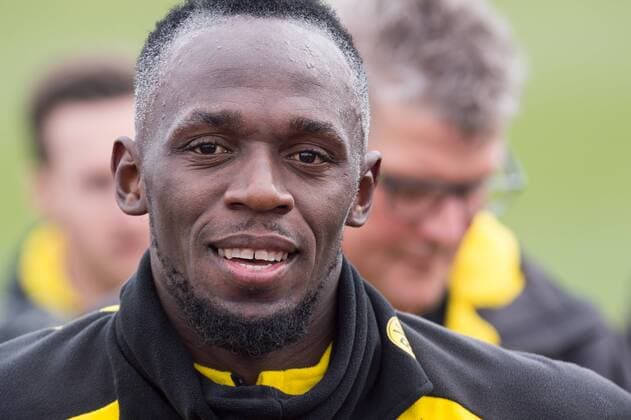 Usain BOLT (ehem. Leichtathletik Profi) beantwortet nach dem Training den Medien ihre Fragen, Interview, TV Interview, Fernsehen, Kameras, Presse, Portraet, Porträt, Portrait, Close up, Fussball 1. Bundesliga, Training, Borussia Dortmund (DO) am 23.03.2018 in Dortmund Deutschland. Â