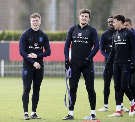 England s Harry Maguire and Alfie Mawson during at the Tottenham Hotspur Training Centre, London. Picture date: March 26th 2018. Picture credit should read: David Klein Sportimage EDITORIAL USE ONLY. No use with unauthorised audio, video, data, fixture lists, club league logos or live services. Online in-match use limited to 120 images, no video emulation. No use in betting, games or single club league player publications.