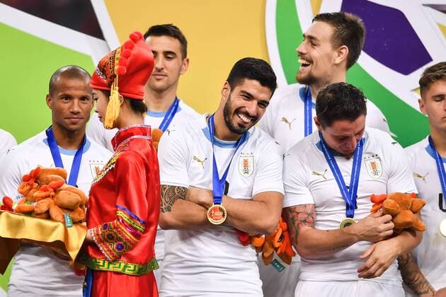 Players of Uruguay national football team take part in the champion award ceremony for the 2018 Gree China Cup International Football Championship in Nanning city, south China s Guangxi Zhuang Autonomous Region, 26 March 2018. Uruguay won the final by 1-0 against Wales and claimed the title of the event. Uruguay claims title of 2018 China Cup Int l Football Championship in Nanning  20180326_72345
