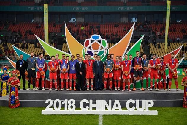 First runner-up Wales national football team take part in the award ceremony after being defeated by Uruguay national football team in their final match during the 2018 Gree China Cup International Football Championship in Nanning city, south China s Guangxi Zhuang Autonomous Region, 26 March 2018. Uruguay won the final by 1-0 against Wales and claimed the title of the event. Uruguay claims title of 2018 China Cup Int l Football Championship in Nanning  20180326_90114