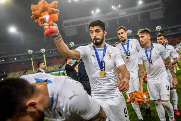 Players of Uruguay national football team take part in the champion award ceremony for the 2018 Gree China Cup International Football Championship in Nanning city, south China s Guangxi Zhuang Autonomous Region, 26 March 2018. Uruguay won the final by 1-0 against Wales and claimed the title of the event. Uruguay claims title of 2018 China Cup Int l Football Championship in Nanning  20180326_29709