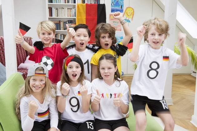 Group of kids watching soccer World Championship WM Weltmeisterschaft cheering model released Symbolfoto property released  NEKF00014